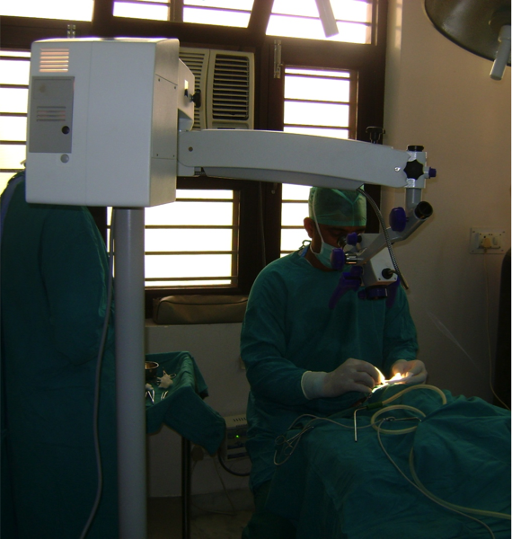 Dr Satya Saraswat Performing the Microvascular Surgery under Zeiss Microscope at Saraswat Hospital, Agra